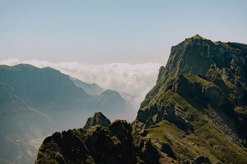 dramatic mountain peaks above clouds in Madeira